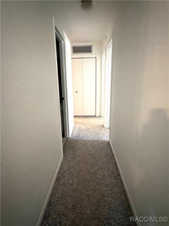 corridor featuring carpet flooring