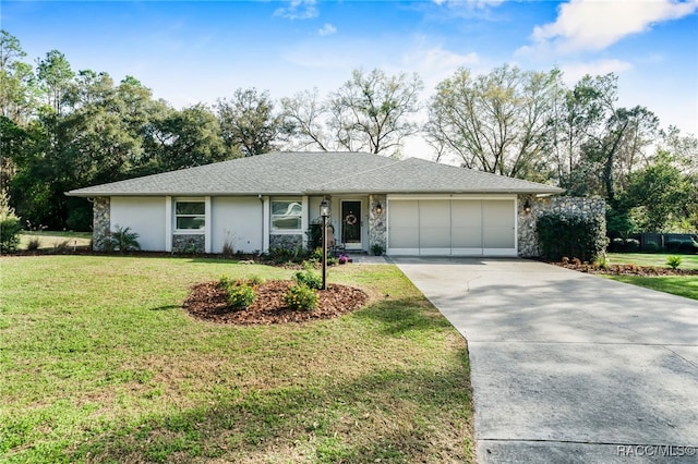 single story home featuring roof with shingles, a front yard, a garage, stone siding, and driveway