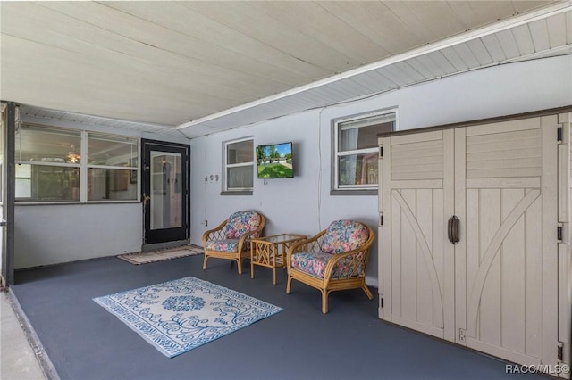 833 Maple Ave, Inverness, FL 34452 - living area featuring finished concrete flooring and wood ceiling