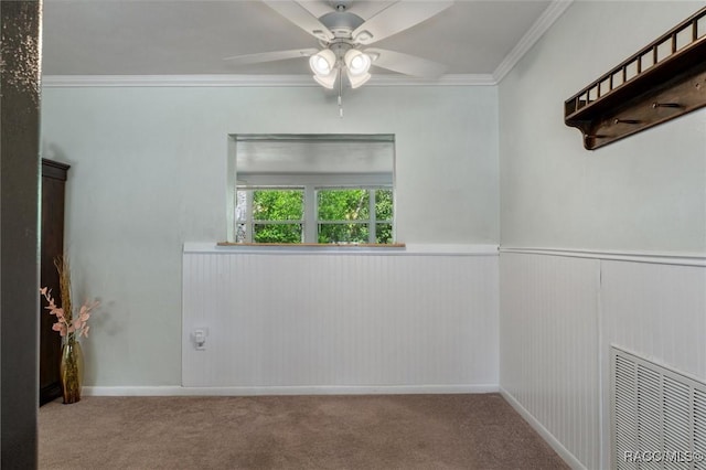 833 Maple Ave, Inverness, FL 34452 - carpeted empty room with ceiling fan, crown molding, and a wainscoted wall