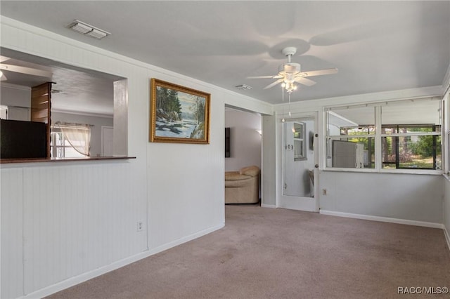 833 Maple Ave, Inverness, FL 34452 - carpeted empty room featuring ceiling fan, baseboards, and crown molding