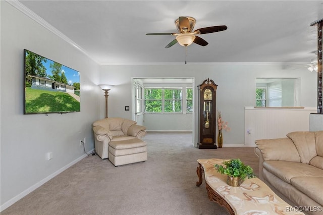 833 Maple Ave, Inverness, FL 34452 - carpeted living room with a ceiling fan, ornamental molding, healthy amount of natural light, and baseboards