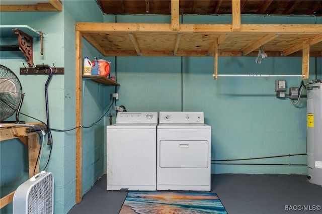 833 Maple Ave, Inverness, FL 34452 - laundry room with washer and dryer, concrete block wall, and gas water heater