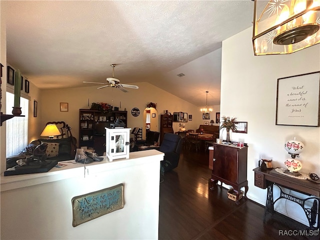 interior space featuring ceiling fan with notable chandelier