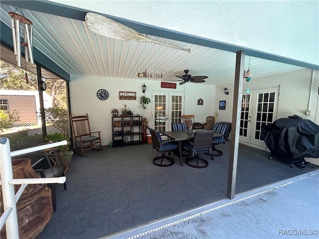 sunroom featuring ceiling fan and french doors