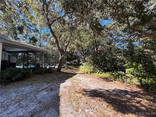 view of yard with ceiling fan