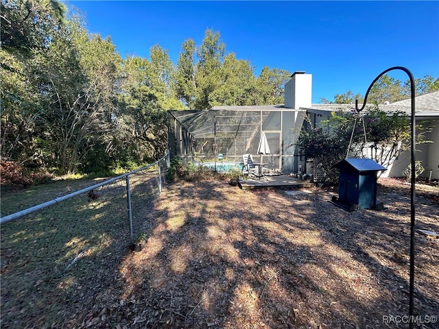 view of yard with a lanai and a patio