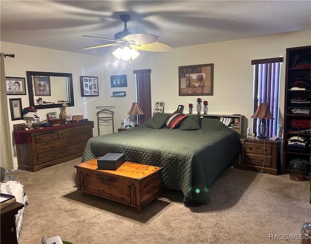 bedroom with ceiling fan and carpet