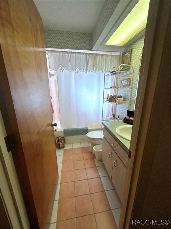 full bathroom with shower / bath combo, tile patterned flooring, a bidet, toilet, and vanity