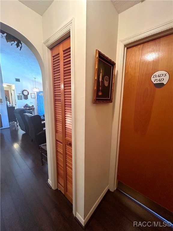 hall with dark wood-type flooring