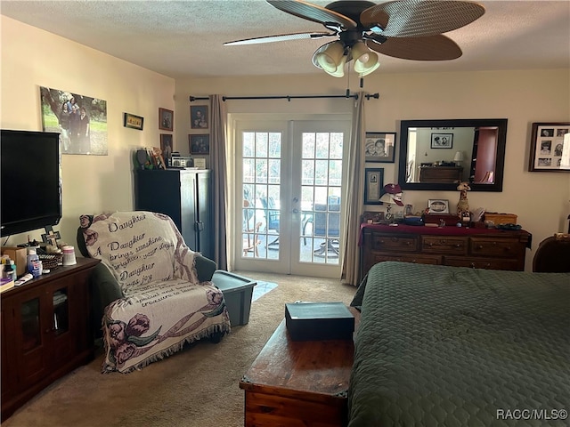 carpeted bedroom featuring access to exterior, french doors, a textured ceiling, and ceiling fan