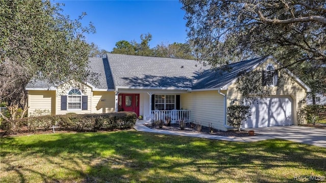 single story home featuring concrete driveway, a shingled roof, an attached garage, and a front yard