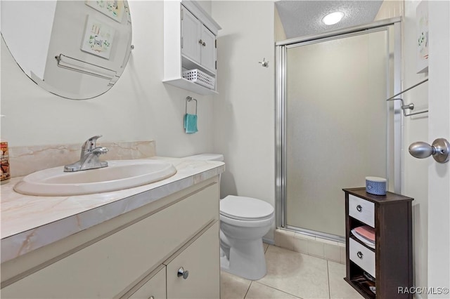 bathroom featuring toilet, a textured ceiling, tile patterned flooring, an enclosed shower, and vanity