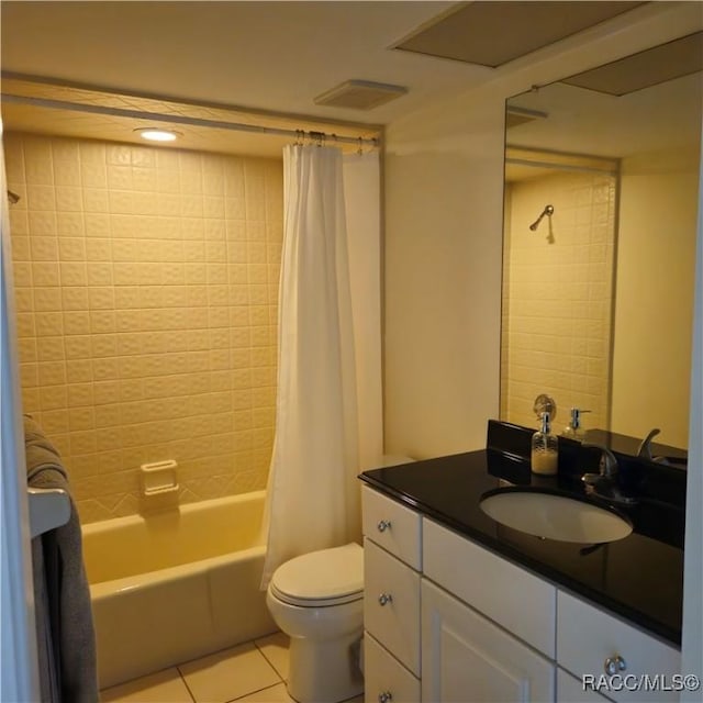 full bathroom with tile patterned flooring, vanity, toilet, and shower / bath combo with shower curtain