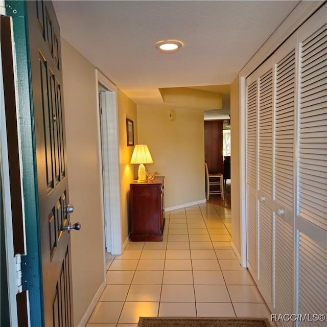 hallway with light tile patterned flooring