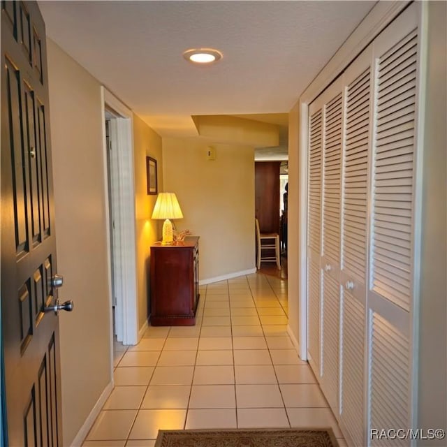 hallway with light tile patterned floors