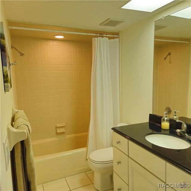 full bathroom with shower / tub combo, vanity, tile patterned floors, and toilet