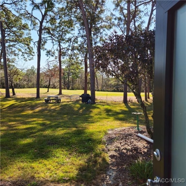 view of home's community featuring a yard