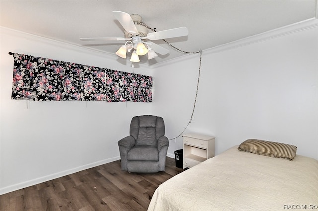 bedroom with dark hardwood / wood-style floors, ceiling fan, and crown molding