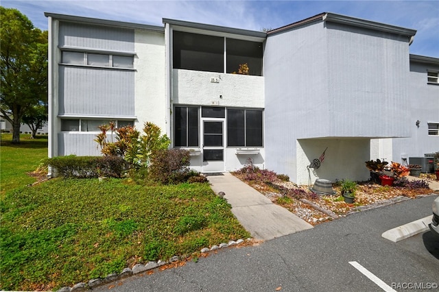 view of building exterior with central air condition unit