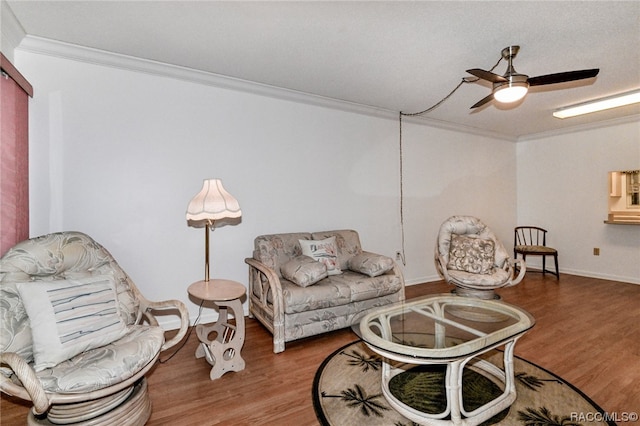 living room featuring wood-type flooring and crown molding