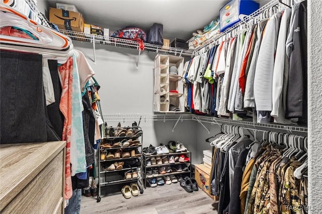 spacious closet with wood finished floors