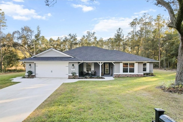 ranch-style house featuring stucco siding, an attached garage, driveway, covered porch, and a front yard