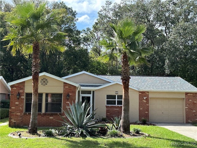 ranch-style house with a front yard and a garage