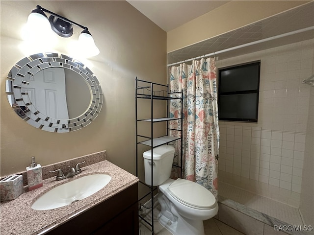 bathroom featuring a shower with curtain, tile patterned flooring, vanity, and toilet