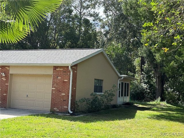 view of property exterior with a yard and a garage