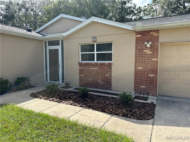 property entrance featuring a garage