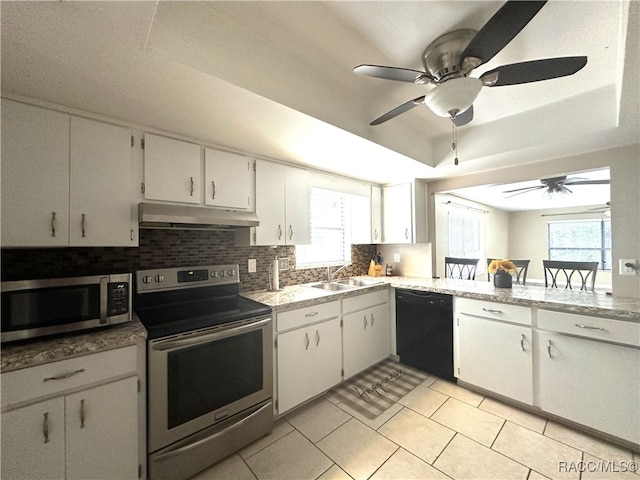 kitchen featuring white cabinets, a healthy amount of sunlight, and stainless steel appliances