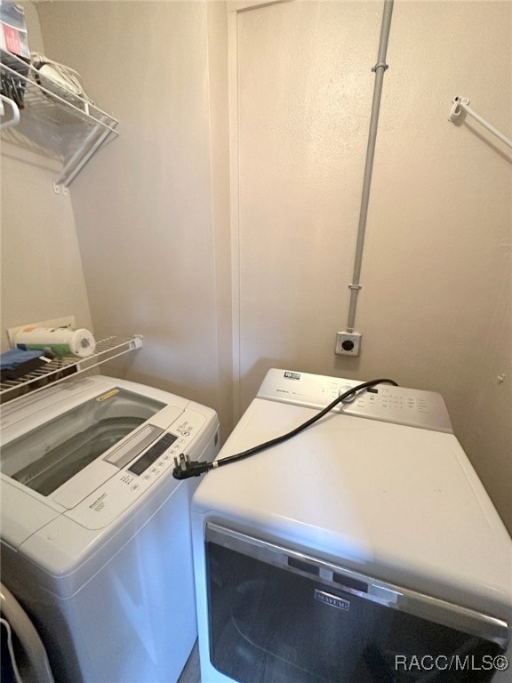 laundry area featuring separate washer and dryer