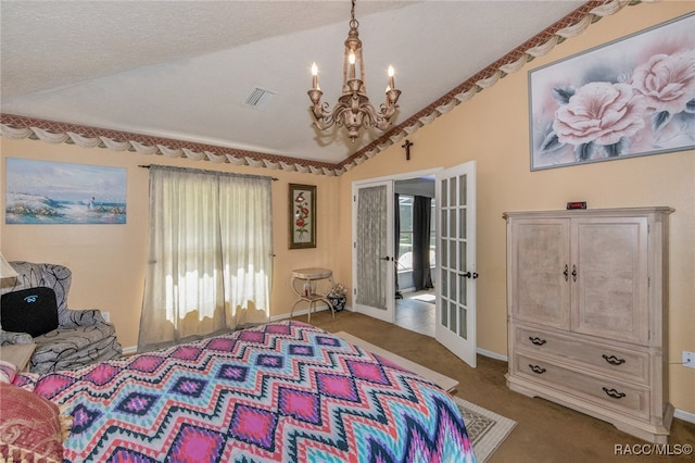 bedroom featuring french doors, an inviting chandelier, vaulted ceiling, and multiple windows