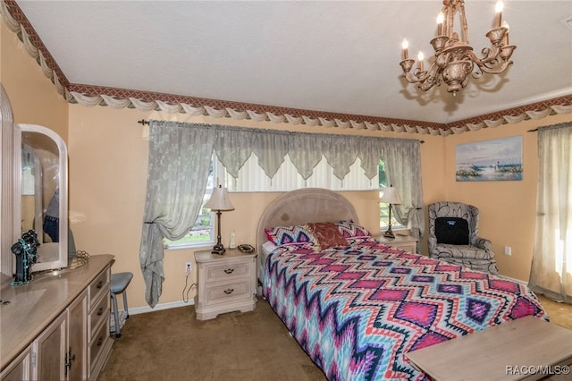 carpeted bedroom featuring a chandelier