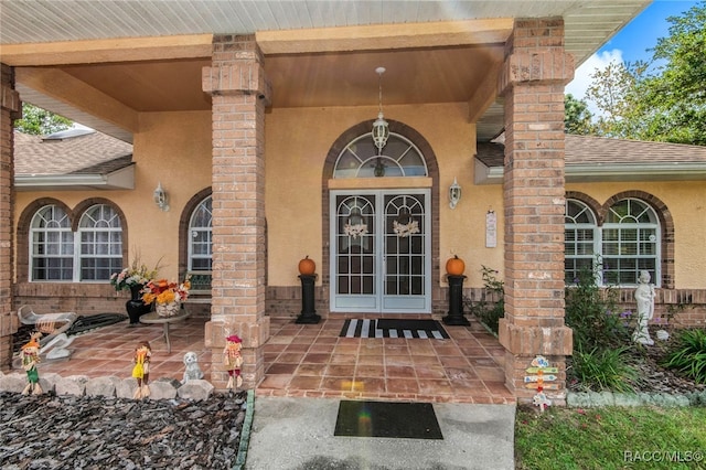 property entrance featuring french doors