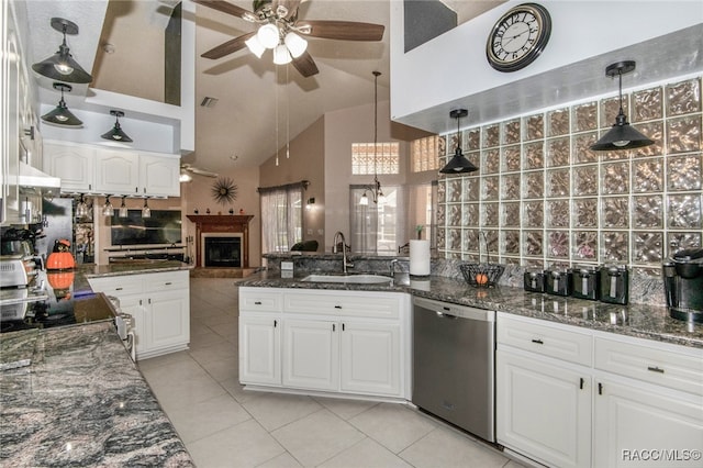 kitchen with pendant lighting, white cabinetry, sink, and stainless steel appliances