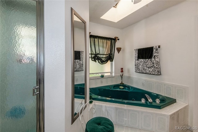 bathroom featuring plus walk in shower and a skylight