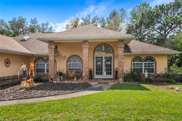 mediterranean / spanish home with a front yard