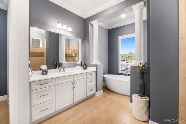 bathroom with tile patterned floors, ornate columns, ornamental molding, vanity, and separate shower and tub