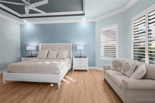 bedroom with light hardwood / wood-style floors, ceiling fan, and crown molding