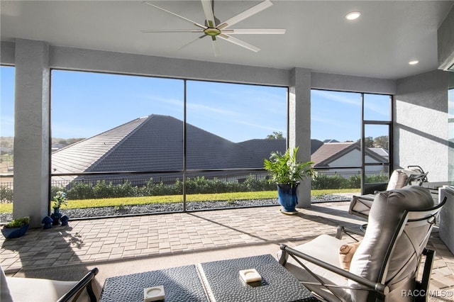 sunroom / solarium with ceiling fan