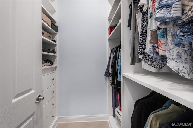 walk in closet featuring light tile patterned floors