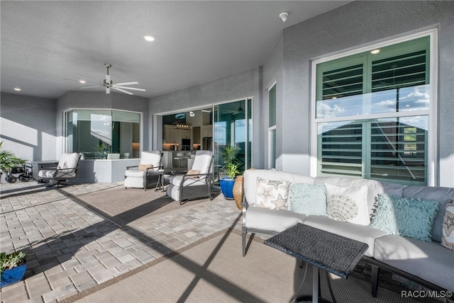 view of patio featuring ceiling fan