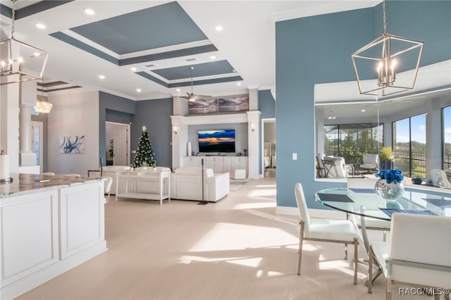 dining space with light wood-type flooring, an inviting chandelier, and crown molding