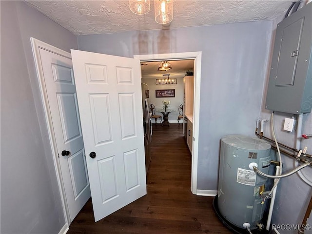 interior space featuring electric panel, water heater, dark wood-type flooring, and a textured ceiling