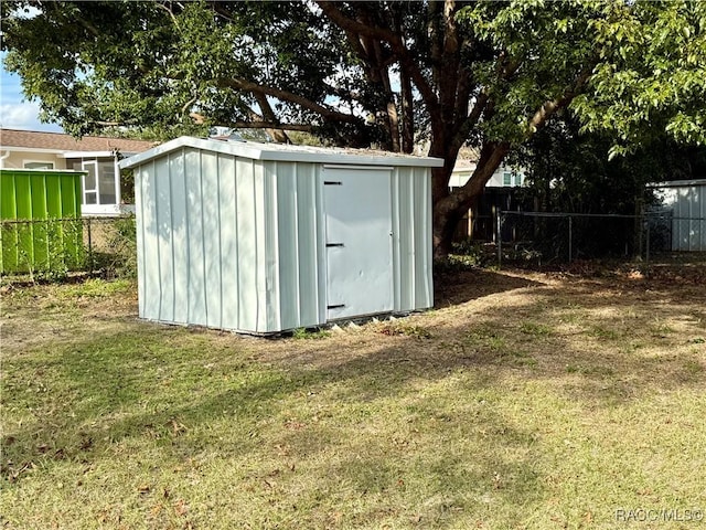 view of outbuilding featuring a yard