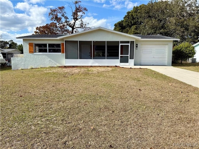 ranch-style house with central air condition unit, a sunroom, a front lawn, and a garage