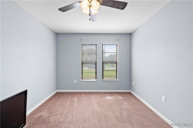 3085 Greynolds Ave, Spring Hill, FL 34608 - carpeted empty room featuring a textured ceiling and ceiling fan