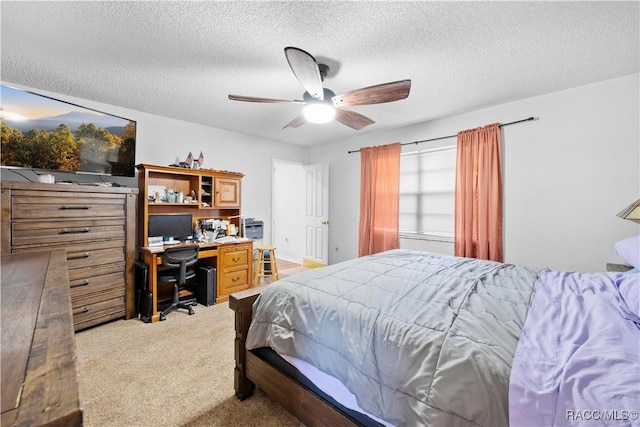 3085 Greynolds Ave, Spring Hill, FL 34608 - bedroom featuring light carpet, a desk, a textured ceiling, and ceiling fan